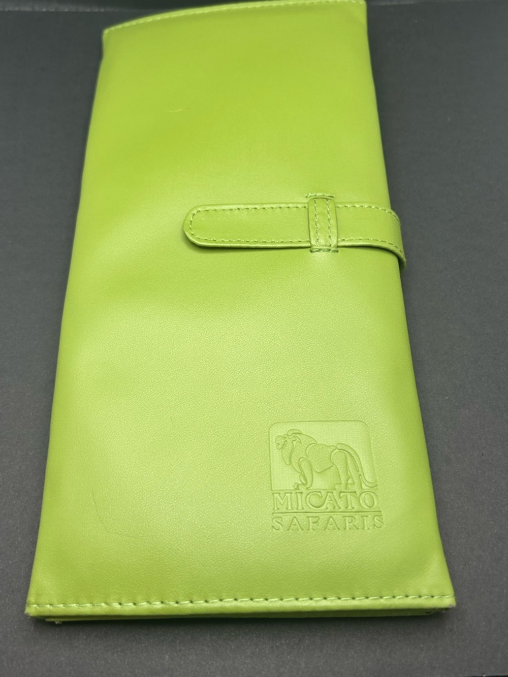 Micato Safaris brand travel wallet or passport holder.